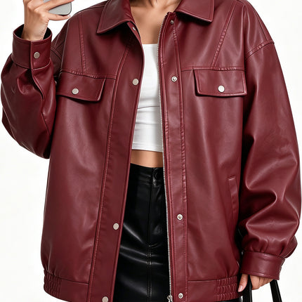 Woman modeling burgundy oversized faux leather utility bomber jacket