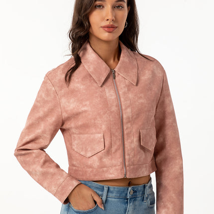 Dusty pink faux leather short zip jacket modeled with jeans